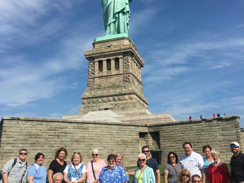 Tour Group in front of Statue of Liberty
