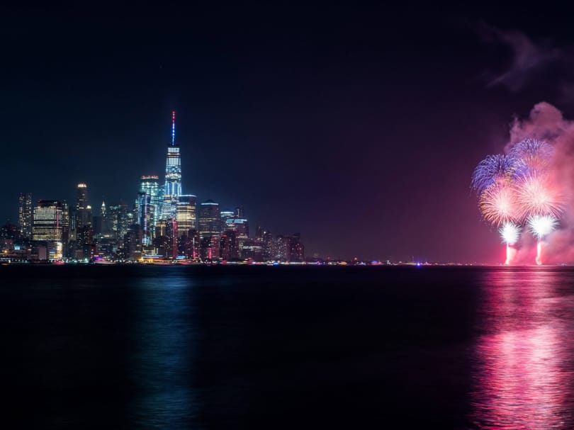 Fourth of July fireworks over New York Harbor with the Lower Manhattan skyline