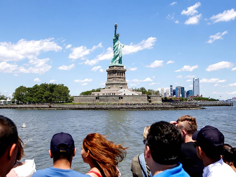 Visitors viewing the Statue of Liberty from the ferry