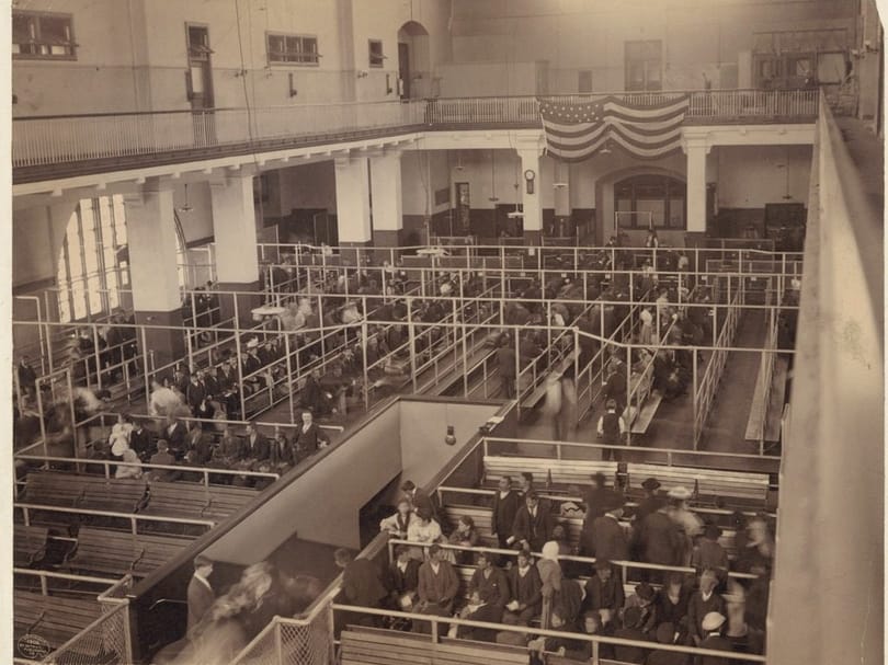 Immigrants and luggage in the baggage room at Ellis Island