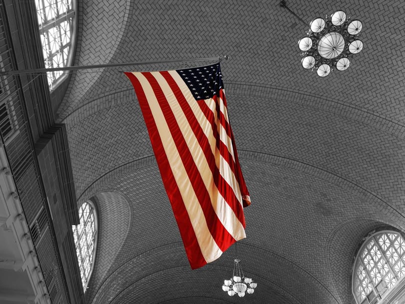 American flag hanging inside the Registry Room at Ellis Island