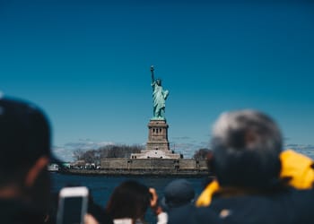 Tourists Looking at the Statue of Liberty