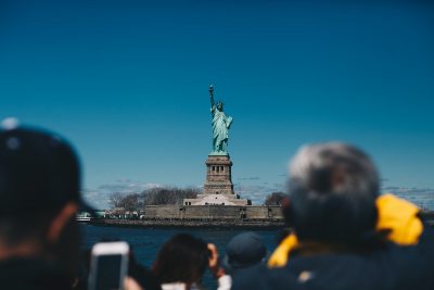 Tourists Looking at the Statue of Liberty