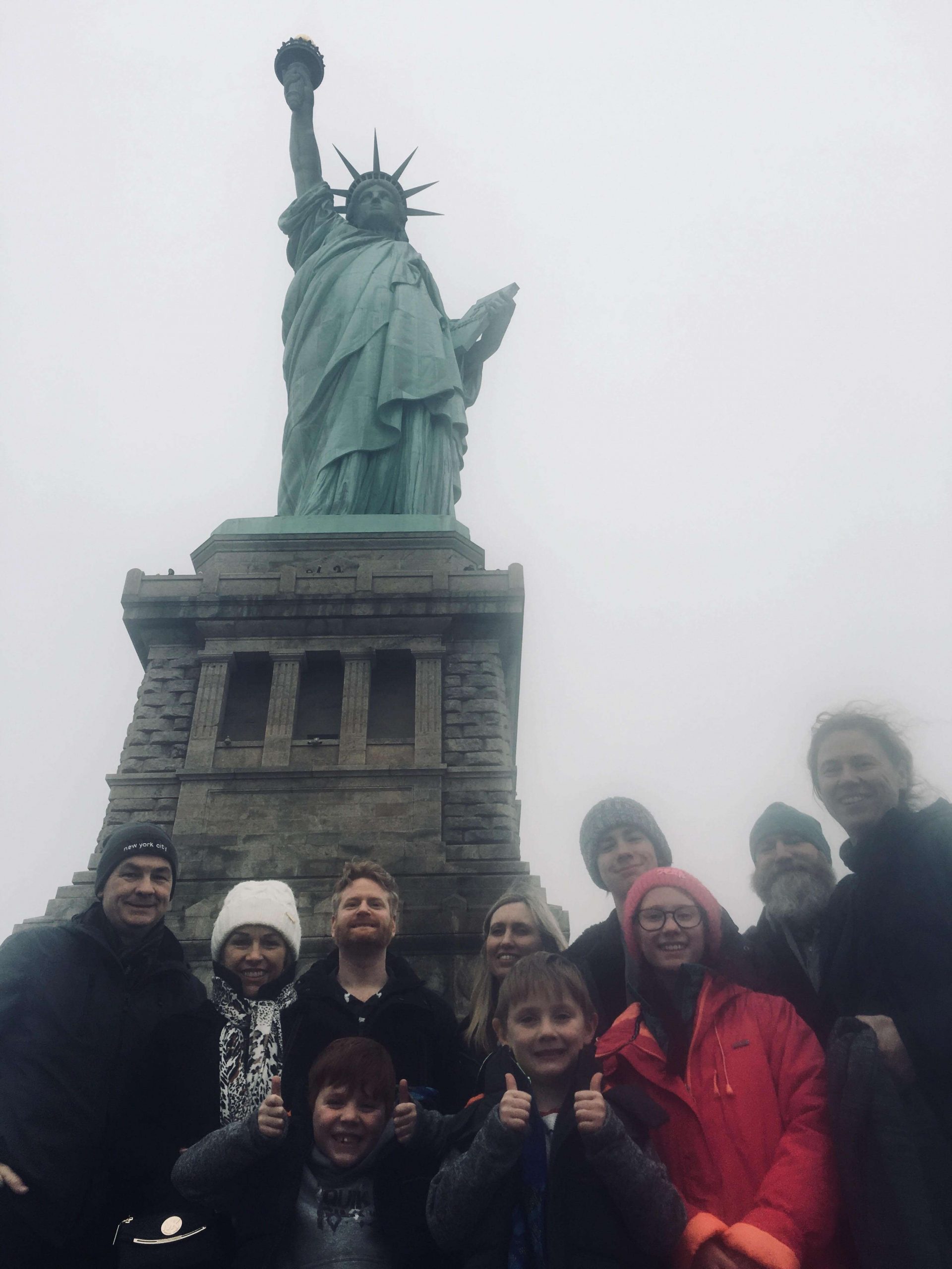 Group photo in front of the statue of liberty