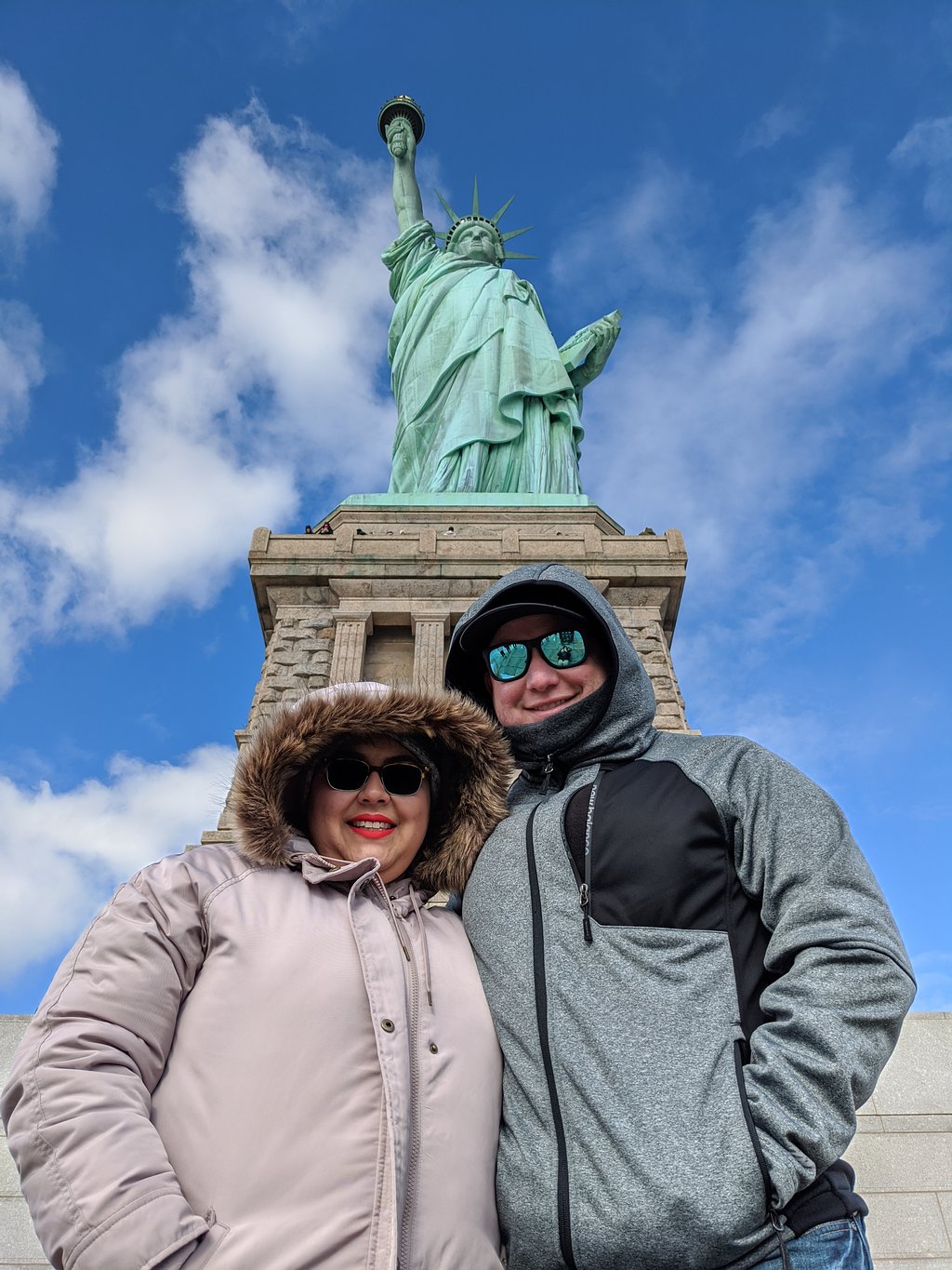 Couple taking a photo on their Statue of Liberty tour