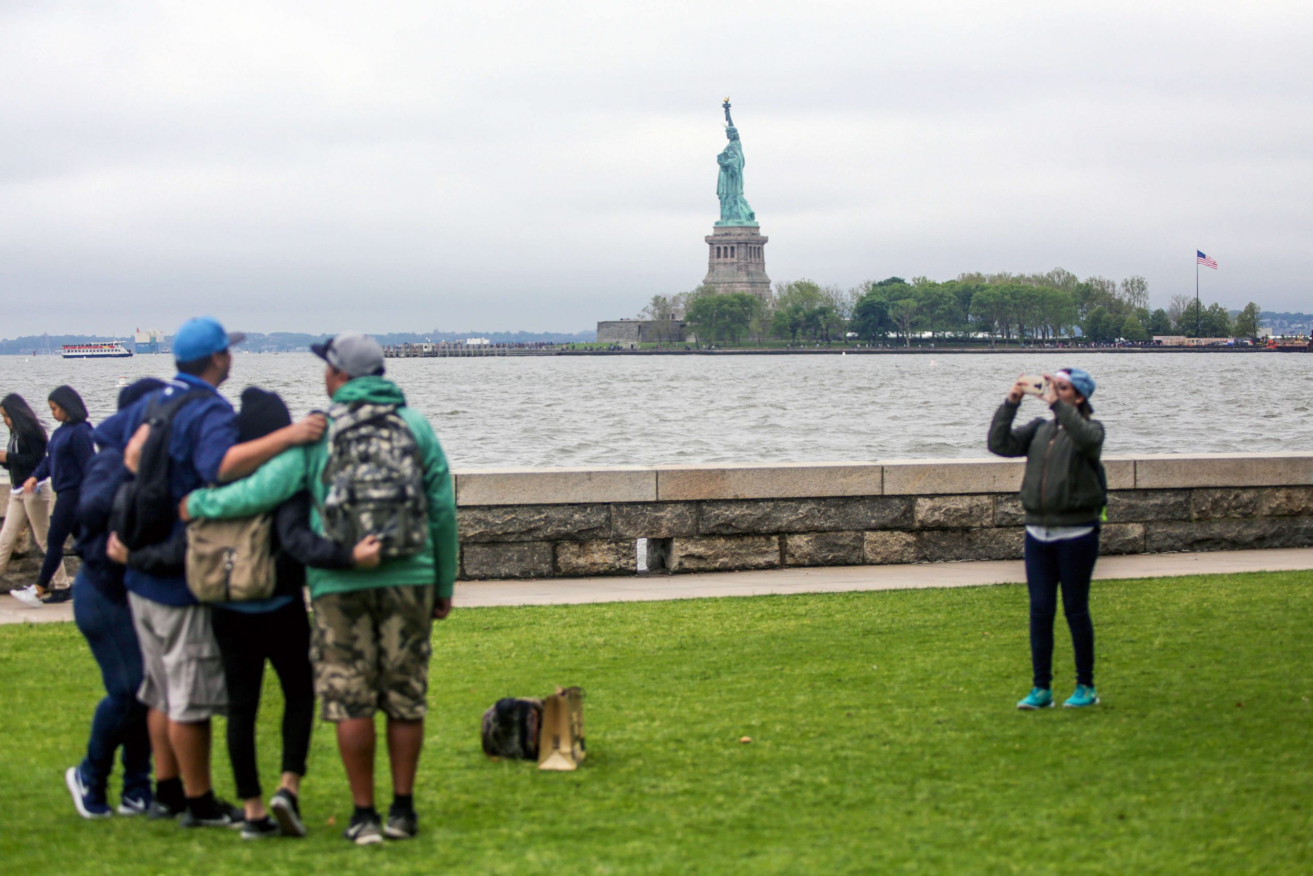 photo with statue of liberty in background