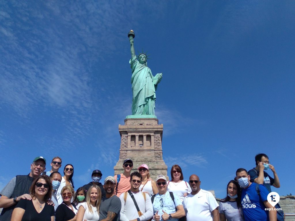 Tour group in front of the Statue of Liberty
