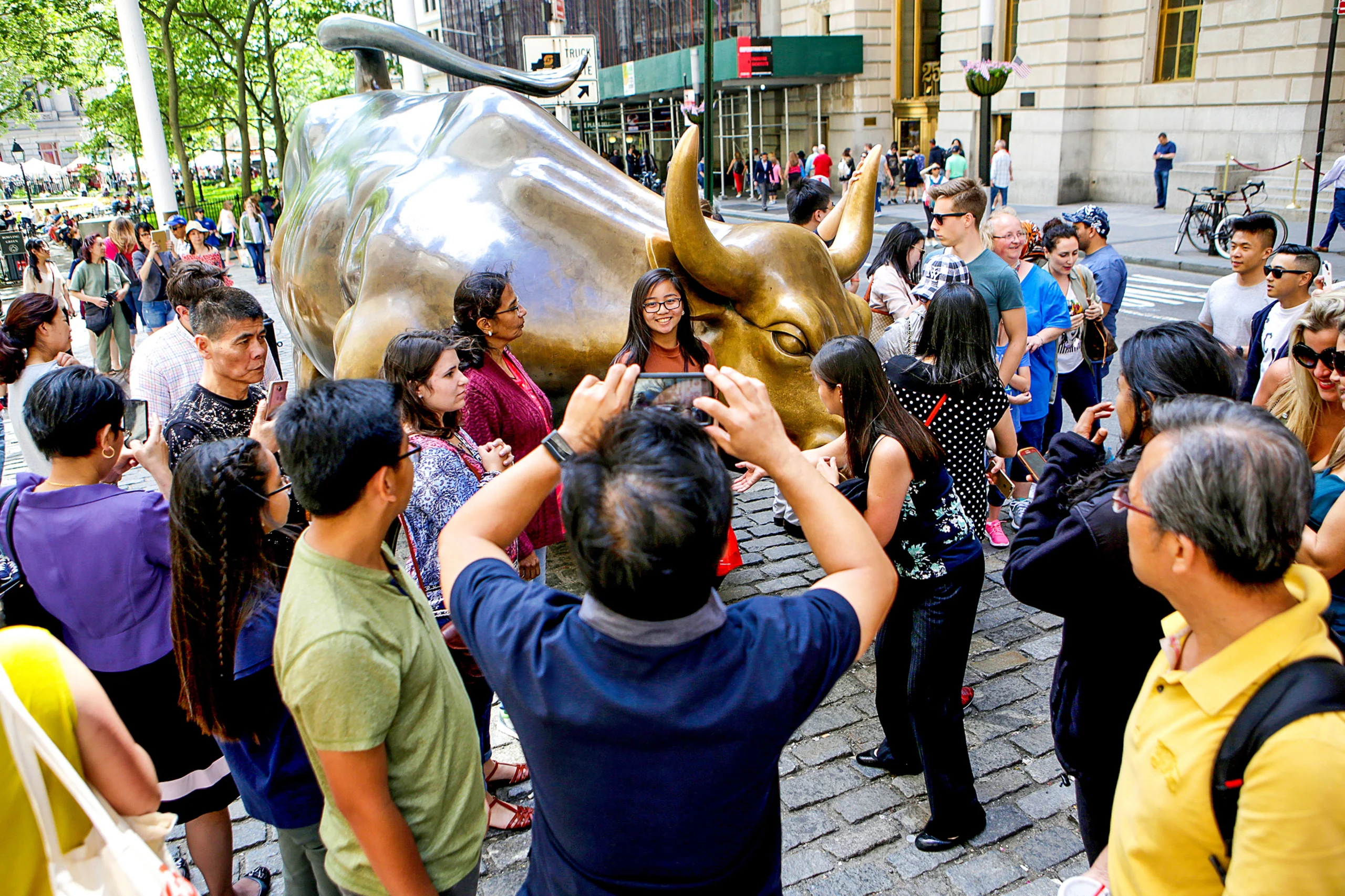 Taking photos with the Charging Bull statue during Lower Manhattan Tour