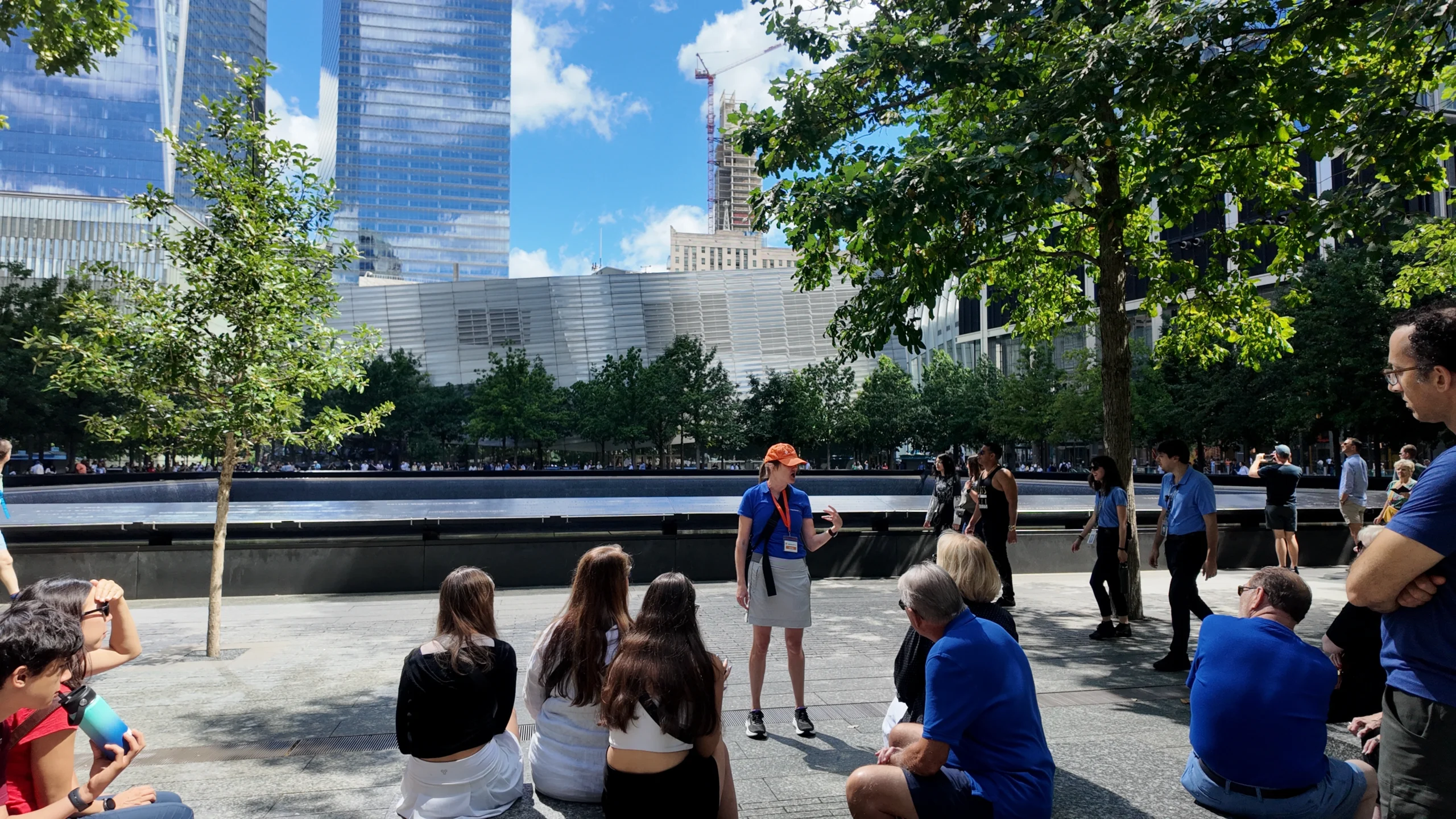 Tour group and guide in front of 9/11 pools during Lower Manhattan Tour