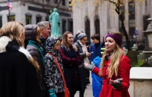Tour group in front of Trinity Church in NYC
